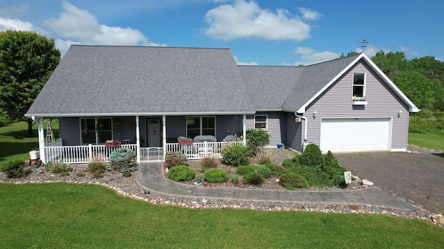 70355 Laine Rd, Iron River, WI 54847 - view of front of home featuring covered porch, a garage, a front lawn, and driveway