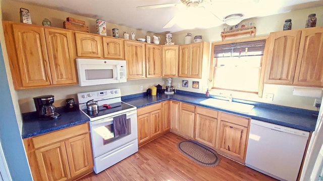 70355 Laine Rd, Iron River, WI 54847 - kitchen with white appliances, light wood-style flooring, dark countertops, a ceiling fan, and light brown cabinetry