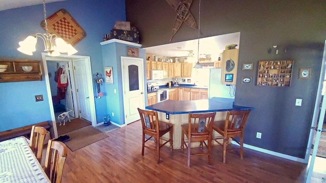 70355 Laine Rd, Iron River, WI 54847 - dining area featuring dark wood-style flooring and a chandelier
