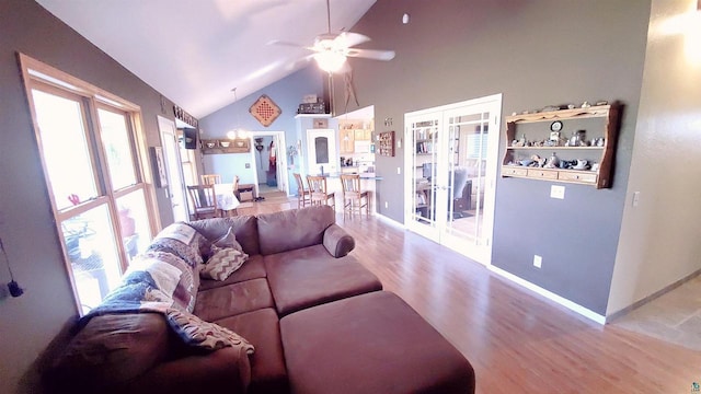 70355 Laine Rd, Iron River, WI 54847 - living room with wood finished floors, french doors, a ceiling fan, and high vaulted ceiling