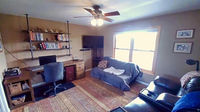 70355 Laine Rd, Iron River, WI 54847 - office area featuring a ceiling fan, plenty of natural light, and wood finished floors