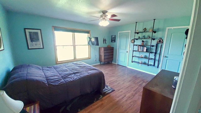 70355 Laine Rd, Iron River, WI 54847 - bedroom with wood finished floors and a ceiling fan