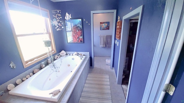 70355 Laine Rd, Iron River, WI 54847 - bathroom featuring a whirlpool tub and tile patterned floors
