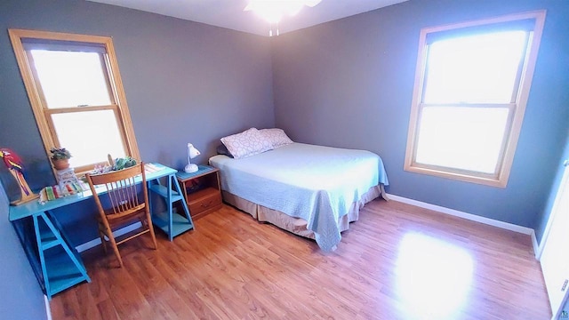 70355 Laine Rd, Iron River, WI 54847 - bedroom featuring wood finished floors and baseboards