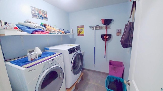 70355 Laine Rd, Iron River, WI 54847 - washroom featuring washing machine and clothes dryer and tile patterned flooring
