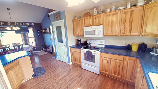 70355 Laine Rd, Iron River, WI 54847 - kitchen with white appliances, light wood-type flooring, a chandelier, vaulted ceiling, and dark countertops