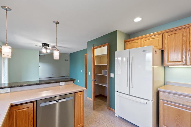 1601 Raspberry Ln, Mount Horeb, WI 53572 - kitchen featuring freestanding refrigerator, stainless steel dishwasher, ceiling fan, light tile patterned floors, and hanging light fixtures