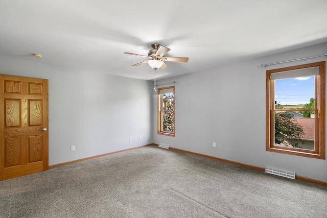 1601 Raspberry Ln, Mount Horeb, WI 53572 - carpeted empty room featuring a ceiling fan and baseboards