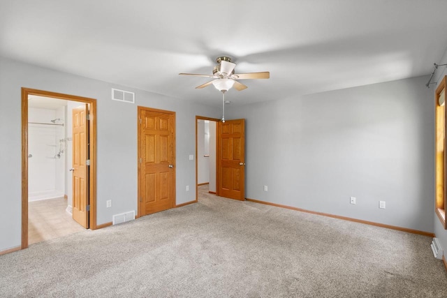 1601 Raspberry Ln, Mount Horeb, WI 53572 - unfurnished bedroom featuring carpet floors, a ceiling fan, and ensuite bath