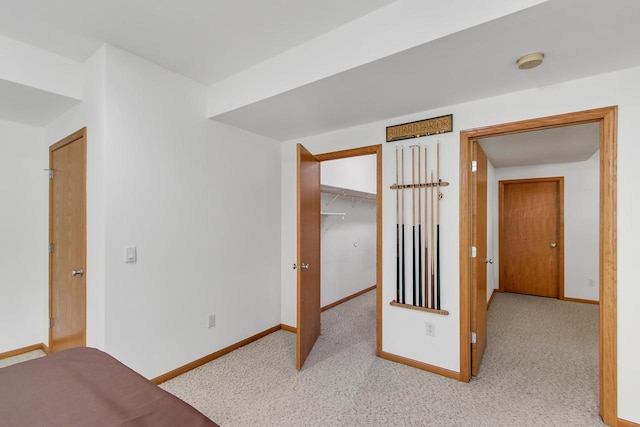 1601 Raspberry Ln, Mount Horeb, WI 53572 - unfurnished bedroom with light carpet, a walk in closet, and a closet