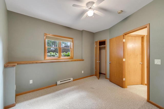 1601 Raspberry Ln, Mount Horeb, WI 53572 - unfurnished bedroom with a baseboard radiator, carpet floors, a closet, and ceiling fan
