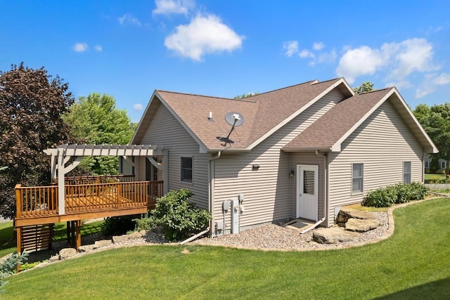 1601 Raspberry Ln, Mount Horeb, WI 53572 - rear view of house featuring a pergola, a wooden deck, roof with shingles, and a lawn