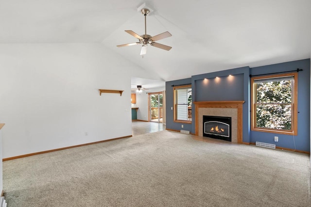 1601 Raspberry Ln, Mount Horeb, WI 53572 - unfurnished living room with ceiling fan, carpet, a fireplace, and vaulted ceiling