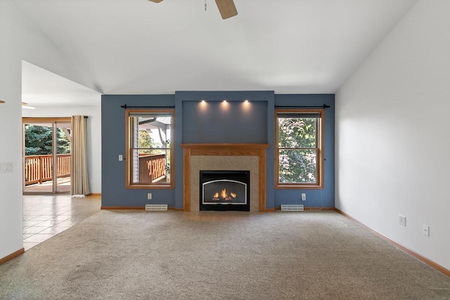 1601 Raspberry Ln, Mount Horeb, WI 53572 - unfurnished living room featuring a ceiling fan, carpet floors, a fireplace, lofted ceiling, and tile patterned flooring