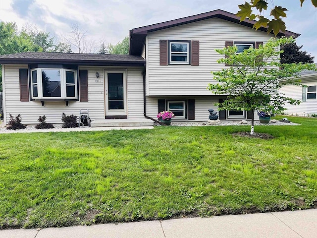 2266 Allerton Dr, Oshkosh, WI 54904 - tri-level home featuring a front yard