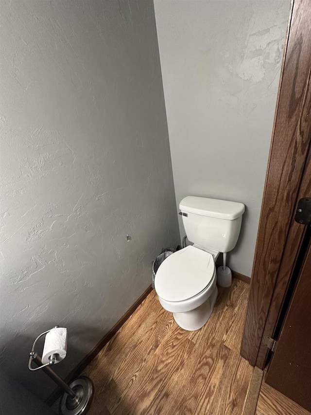 2266 Allerton Dr, Oshkosh, WI 54904 - bathroom featuring wood finished floors and toilet