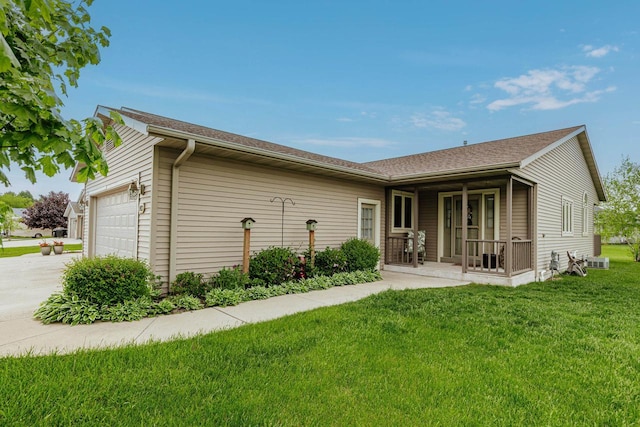 143 Parkview Ct, Cedar Grove, WI 53013 - back of house with a garage, concrete driveway, and a yard