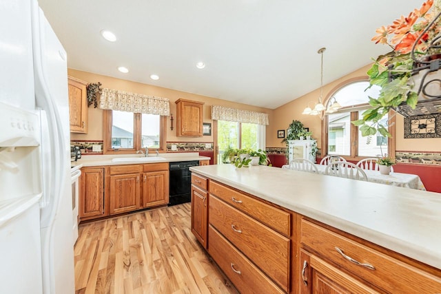 143 Parkview Ct, Cedar Grove, WI 53013 - kitchen with white fridge with ice dispenser, dishwasher, light countertops, light wood-style floors, and a chandelier