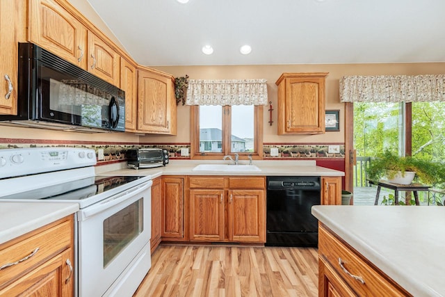143 Parkview Ct, Cedar Grove, WI 53013 - kitchen featuring black appliances, light countertops, light wood-type flooring, and recessed lighting