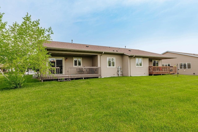 143 Parkview Ct, Cedar Grove, WI 53013 - rear view of house with a wooden deck and a lawn