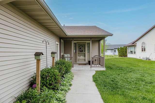 143 Parkview Ct, Cedar Grove, WI 53013 - entrance to property with a porch, a yard, and a shingled roof