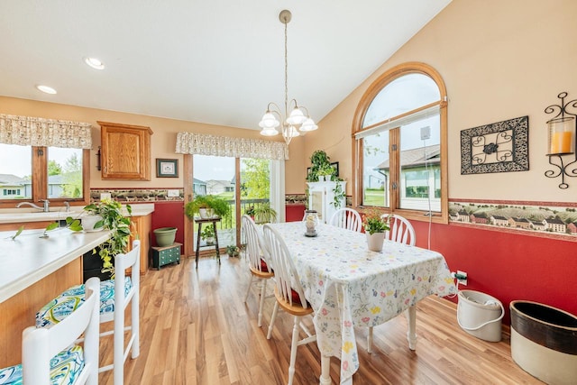 143 Parkview Ct, Cedar Grove, WI 53013 - dining room with light wood-style flooring, a chandelier, vaulted ceiling, and recessed lighting