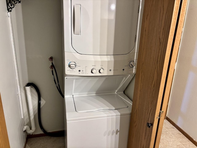 1712 Creek Rd Unit 202, West Bend, WI 53090 - laundry area with estacked washer and dryer and light tile patterned flooring
