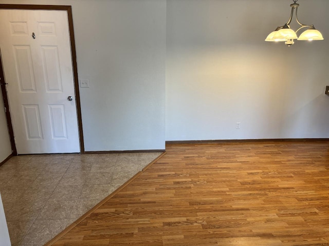 1712 Creek Rd Unit 202, West Bend, WI 53090 - unfurnished room featuring wood finished floors and baseboards