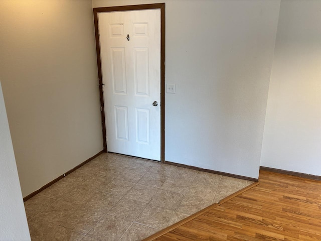 1712 Creek Rd Unit 202, West Bend, WI 53090 - empty room featuring baseboards and wood finished floors