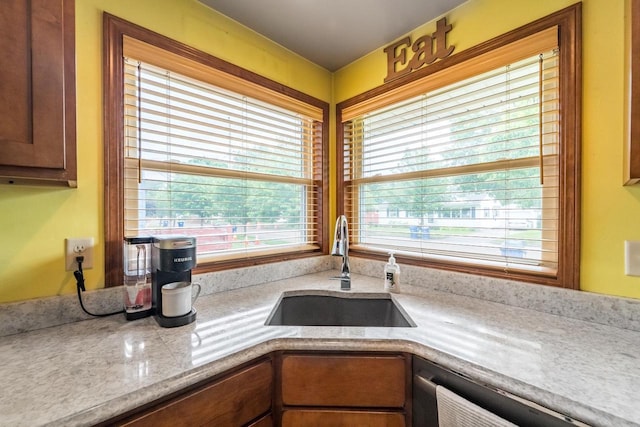 1508 Pearson St, Wausau, WI 54401 - kitchen with dishwasher, plenty of natural light, and light stone countertops