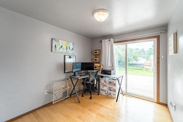 1508 Pearson St, Wausau, WI 54401 - home office featuring hardwood / wood-style flooring and baseboards