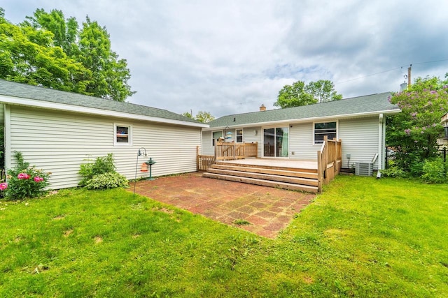 1508 Pearson St, Wausau, WI 54401 - back of property featuring a deck, a lawn, and a patio