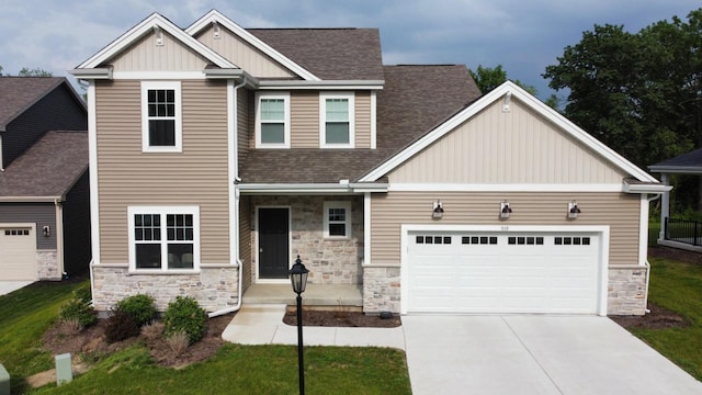 310 Paradise Ct, Hartland, WI 53029 - craftsman inspired home featuring stone siding, board and batten siding, roof with shingles, and driveway