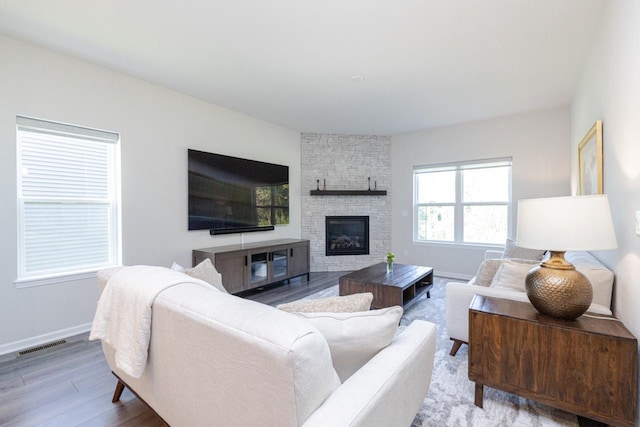 310 Paradise Ct, Hartland, WI 53029 - living room with wood finished floors and a stone fireplace