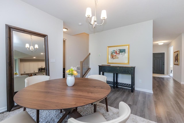 310 Paradise Ct, Hartland, WI 53029 - dining room with a chandelier, wood finished floors, and stairway