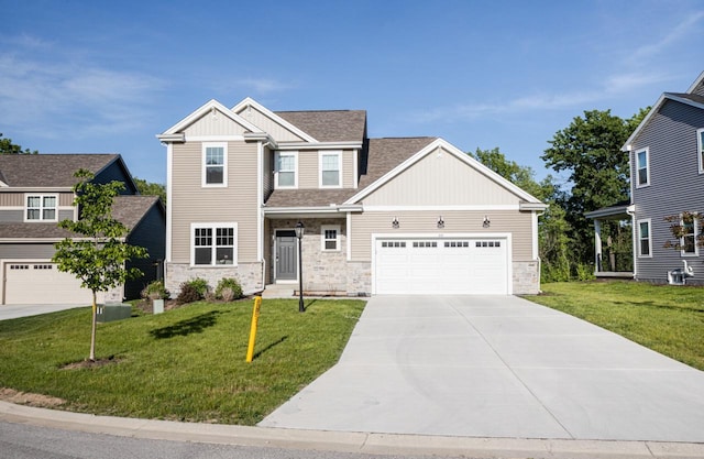 310 Paradise Ct, Hartland, WI 53029 - craftsman-style home with board and batten siding, stone siding, and a front yard