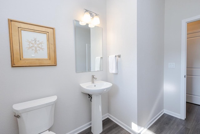 310 Paradise Ct, Hartland, WI 53029 - half bath with wood finished floors and toilet