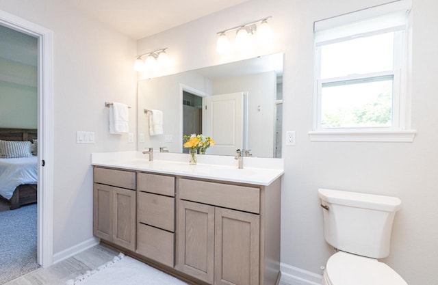 310 Paradise Ct, Hartland, WI 53029 - ensuite bathroom with double vanity and toilet
