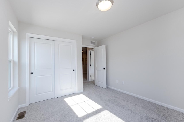 310 Paradise Ct, Hartland, WI 53029 - unfurnished bedroom featuring carpet and a closet