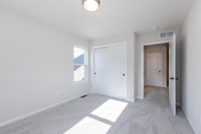310 Paradise Ct, Hartland, WI 53029 - unfurnished bedroom with light carpet and a closet