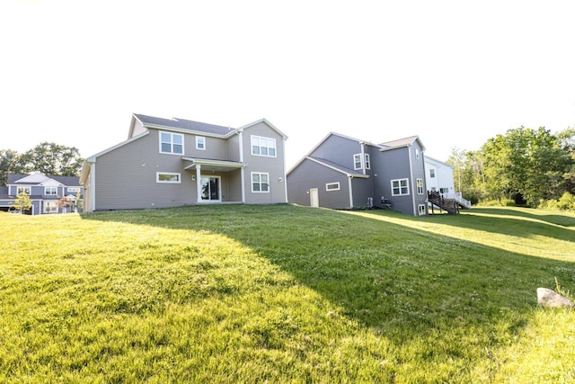 310 Paradise Ct, Hartland, WI 53029 - back of property featuring a yard