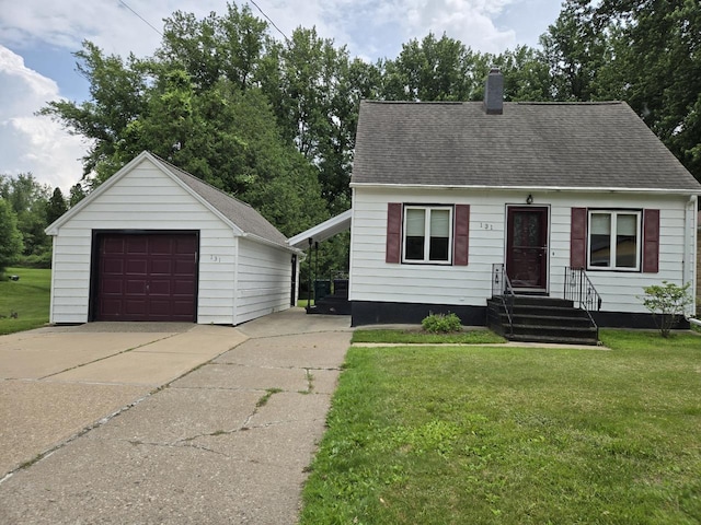 131 Crestview Ln, Nekoosa, WI 54457 - cape cod home featuring a garage, an outbuilding, a chimney, driveway, and a front yard