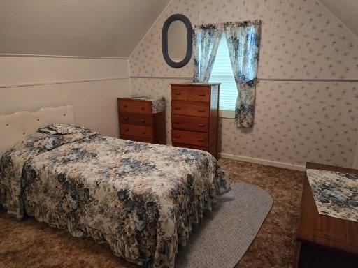 131 Crestview Ln, Nekoosa, WI 54457 - carpeted bedroom featuring vaulted ceiling and wallpapered walls