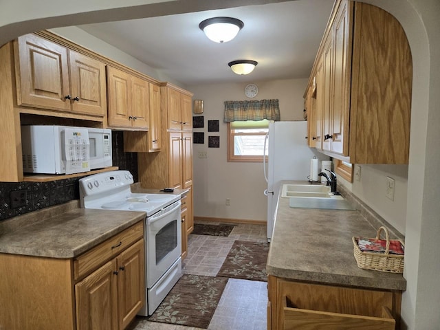 131 Crestview Ln, Nekoosa, WI 54457 - kitchen with white appliances, arched walkways, and dark stone finish floors