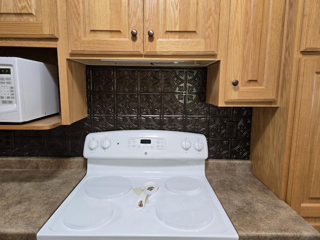 131 Crestview Ln, Nekoosa, WI 54457 - kitchen view of white appliances and decorative backsplash