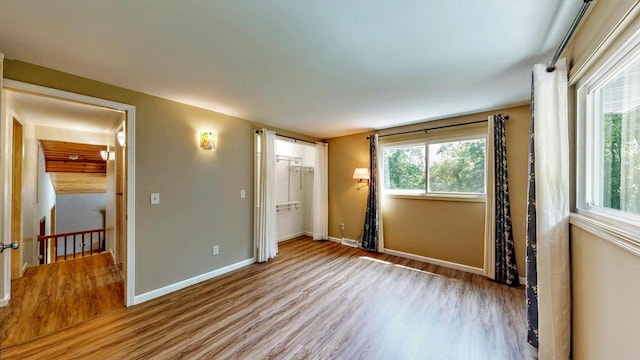 N2493 Kunz Rd, Fort Atkinson, WI 53538 - unfurnished bedroom featuring wood finished floors and baseboards