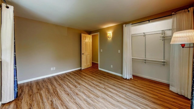 N2493 Kunz Rd, Fort Atkinson, WI 53538 - unfurnished bedroom featuring wood finished floors and a closet