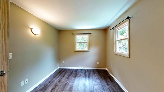N2493 Kunz Rd, Fort Atkinson, WI 53538 - empty room featuring dark wood finished floors and baseboards