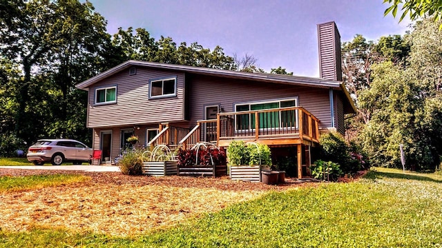 N2493 Kunz Rd, Fort Atkinson, WI 53538 - tri-level home with a chimney, a front yard, and a deck
