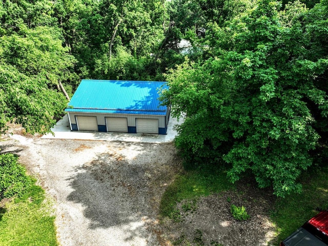 N2493 Kunz Rd, Fort Atkinson, WI 53538 - view of front of home featuring a metal roof, a garage, and an outbuilding